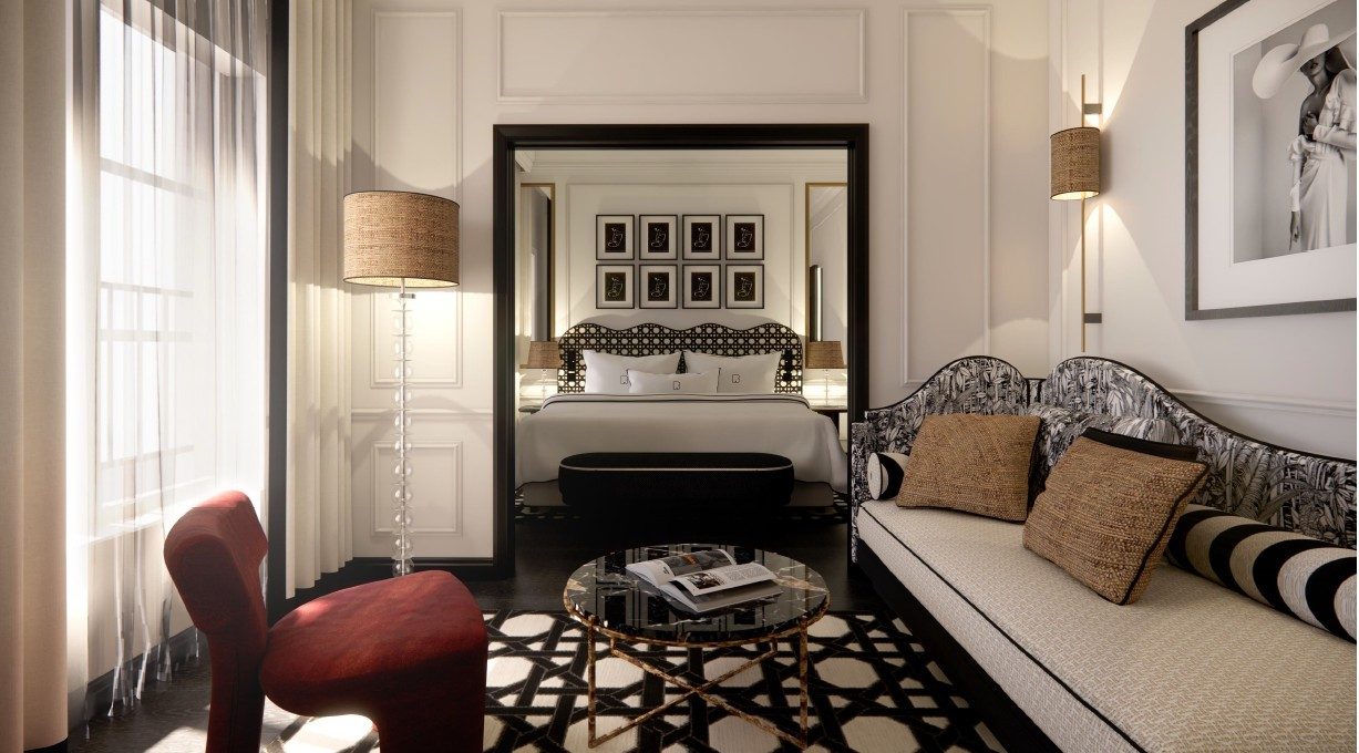 Salon d'une Junior Suite rénovée du Burgundy Paris, ouvert sur la chambre